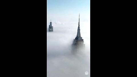 Empire State Building above the clouds New York City
