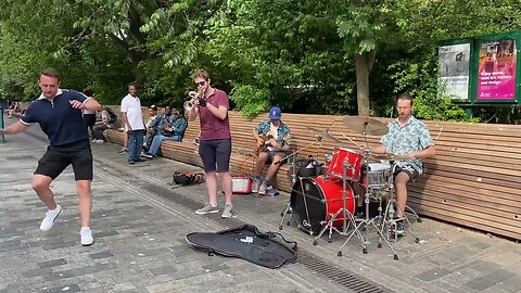 Some nice moves! With a surprise dancer, musicians Guy, Simeon & Dom first busking experience!