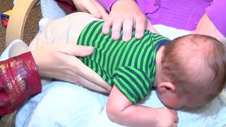 Chiropractor evaluates infant