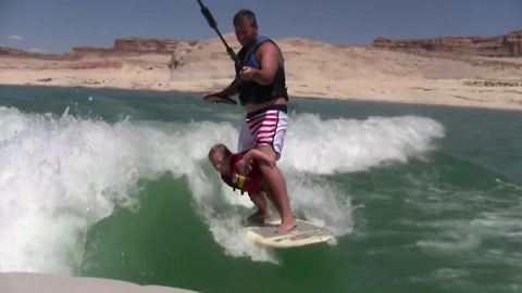 "Father and Daughter Wakeboarding Fun"