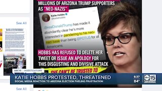 Arizona Secretary of State Katie Hobbs protested, threatened