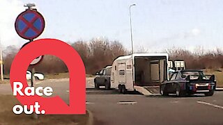 A car falls out a trailer just off a motorway