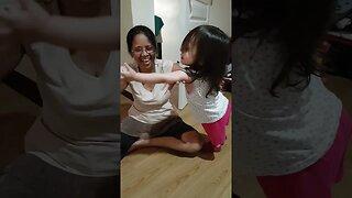 Beautiful grandmother plays with her baby girl