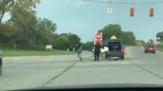 VIDEO: Body falls out of van in Ypsilanti