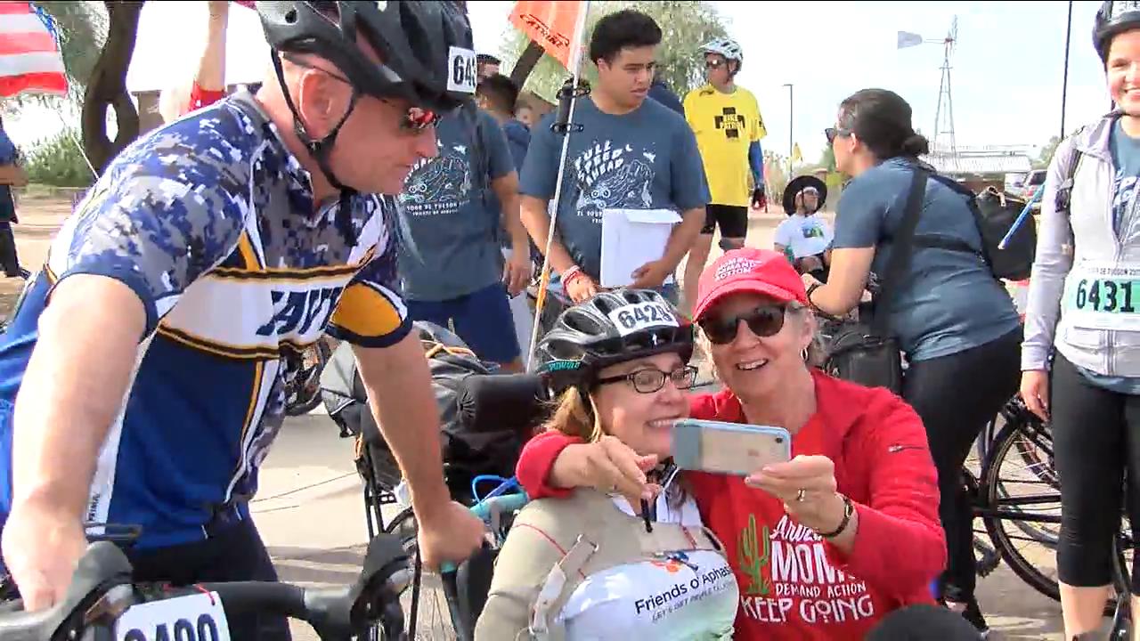 Senate Candidate Mark Kelly rides alongside Gabrielle Giffords in El Tour de Tucson