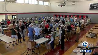 Multi-faith volunteers pack meals in West Palm Beach