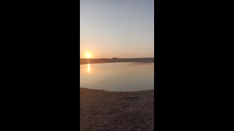 Beautiful sunset on the river bank.