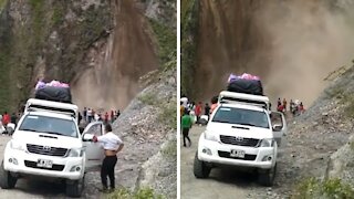 Massive land slides in front of group of people in terrifying video