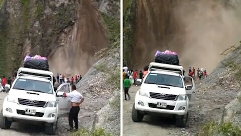 Massive land slides in front of group of people in terrifying video