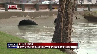 People evacuate from their homes due to flooding in Luna Pier