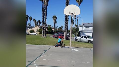 Tot Boy Crashes Into Basketball Hoop On His Bike