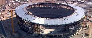 Crews install glass at Allegiant Stadium