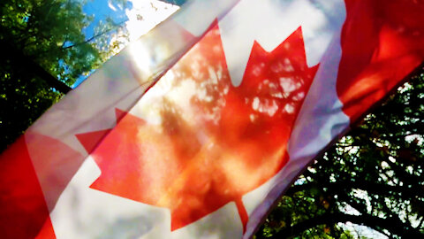 Canadian flag sun flares, slow-motion close-up