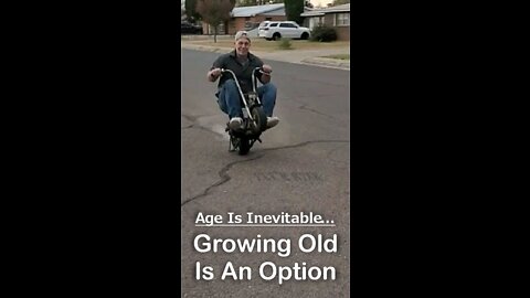 53 year old riding a wheelie on his mini bike.