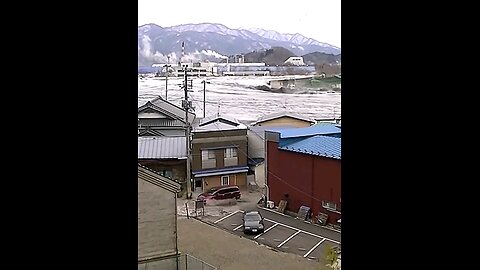 Raging Deluge: Tsunami's Torrent Sweeping Through Town
