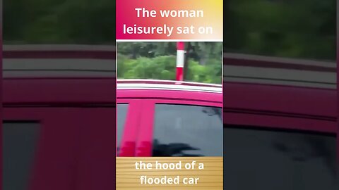 The woman leisurely sat on the hood of a flooded car #beautiful