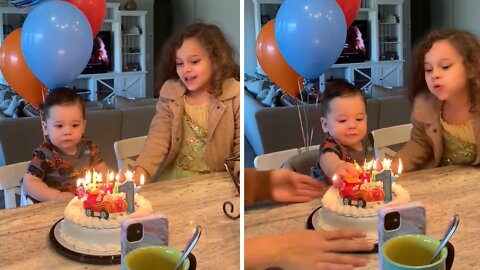 Excited Baby Uses His Hand To Put Out Birthday Candles