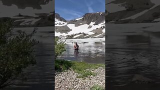 cold plunge in partially frozen lake in July
