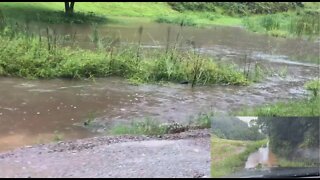 It's raining again Part IV. A tour of our road up the other end as it starts to flood.