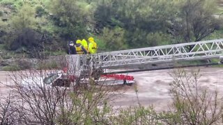 Emergency crews rescue truck occupants from floodwaters near Cave Creek