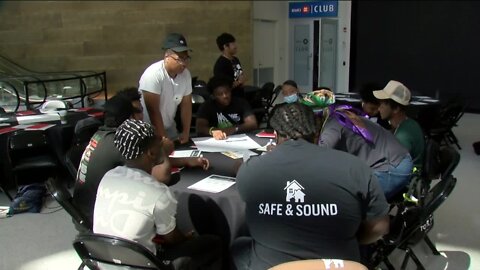 Young people gather at Fiserv Forum's atrium to discuss reckless driving, mentoring