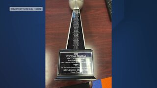 Bennett High football team receives trophy from Thurman Thomas
