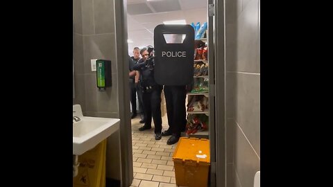 Man Gets A Group Of Armed Police Go At Him While He's Taking A Dump