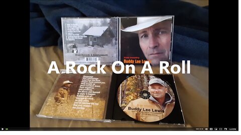 A Rock on a Roll By Buddy Lee Lewis