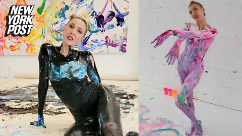 Bikini-clad dancer paints using her body as the brush