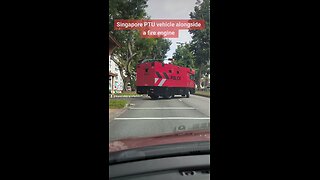 Singapore Police Tactical Unit vehicle next to a Fire Engine