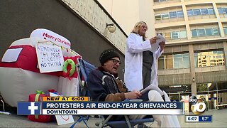 Protesters air end-of-year grievances outside City Hall