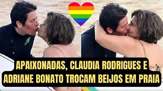 Apaixonadas, Claudia Rodrigues e Adriane Bonato trocam beijos em praia - E VIVA O AMOR!