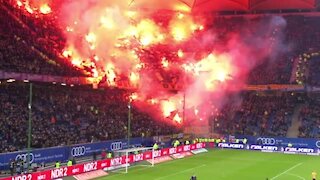 German soccer fans light up massive section of seats with flares