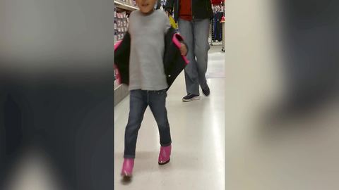 "Little Girl Takes New Boots For A Walk"