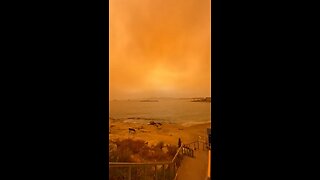 African dust shrouding Greece casts an otherworldly orange glow
