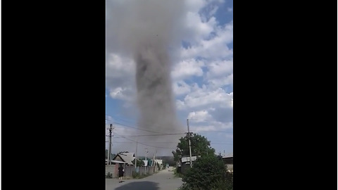 Giant dust vortex hovers over capital city