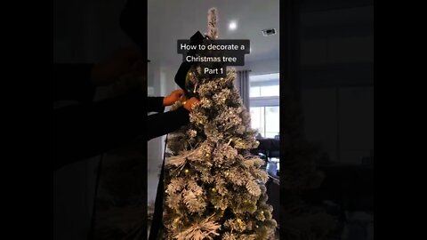 Golden Retriever "helps" decorate Christmas tree