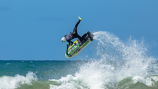 Jet Skier sending a one foot roll on the waves