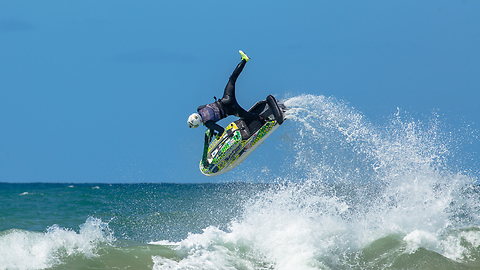 Jet Skier sending a one foot roll on the waves