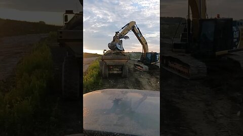 Stripping Top Soil with Excavator and Rock Trucks