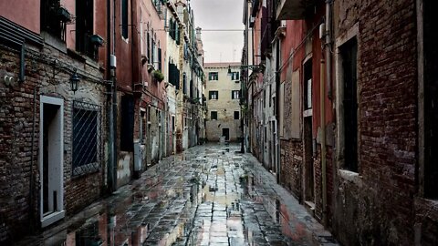 Rain on cobblestones in a picturesque alley of Venezia, Venice, Italy