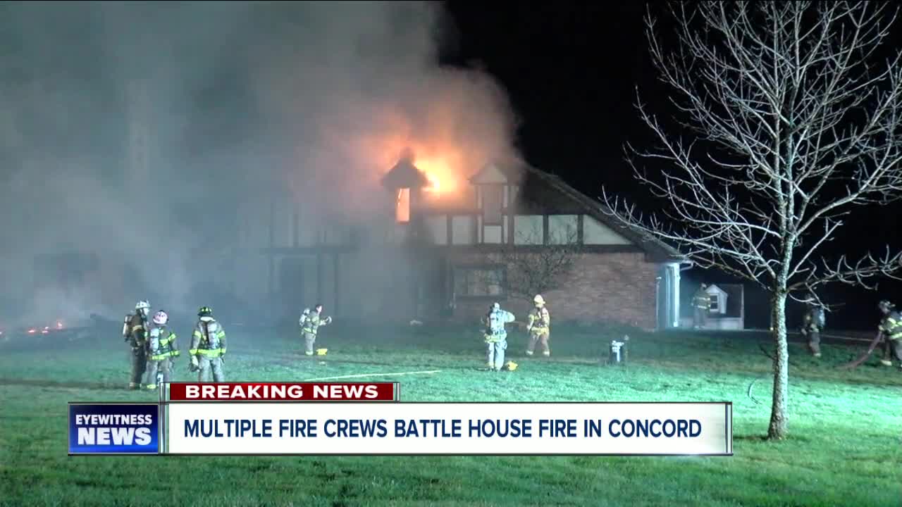 Multiple crews battling house fire in Concord