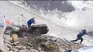 Giant rock almost hits mountain-climbers!