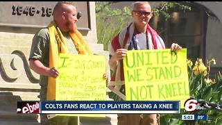 Men protest kneeling during national anthem of football games