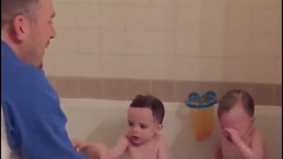 Dad Sprays Water In Kids Face With Bath Toy