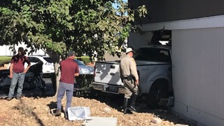 Truck crashes into apartment, 3 injured