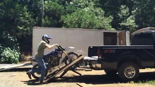 Ramp breaks while loading motorcycle onto truck