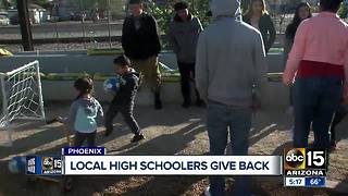 High school students build mini soccer goals for underprivileged kids