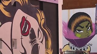 Artist adding murals to buildings in Downtown Las Vegas