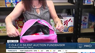 COACH silent auction fundraiser gives to needy kids
